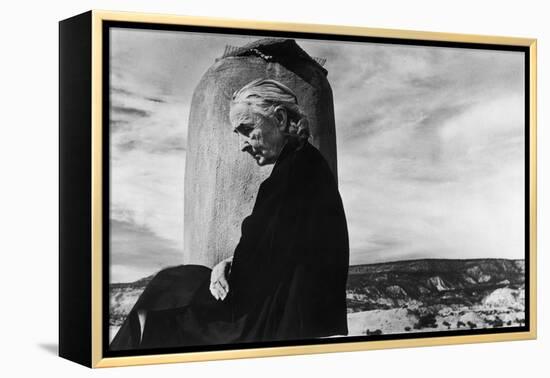 Portrait of Artist Georgia O'Keeffe Sitting on the Roof of Her Ghost Ranch Home-John Loengard-Framed Premier Image Canvas