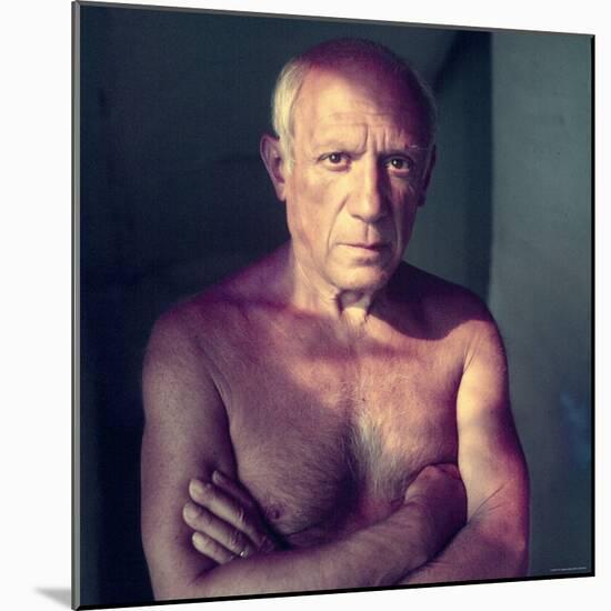 Portrait of Artist Pablo Picasso, Arms Folded Across Bare Chest, at His Home, Alone-Gjon Mili-Mounted Premium Photographic Print