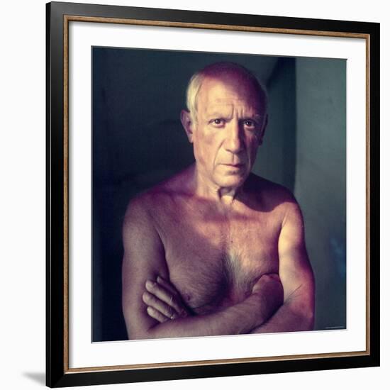 Portrait of Artist Pablo Picasso, Arms Folded Across Bare Chest, at His Home, Alone-Gjon Mili-Framed Premium Photographic Print