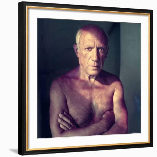 Portrait of Artist Pablo Picasso, Arms Folded Across Bare Chest, at His Home, Alone-Gjon Mili-Framed Premium Photographic Print