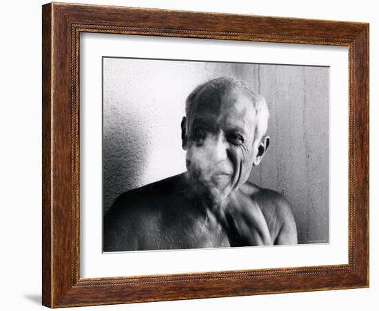 Portrait of Artist Pablo Picasso, Bare Chested and Smiling-Gjon Mili-Framed Premium Photographic Print