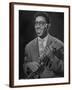 Portrait of Dizzy Gillespie, "Bebop" King, Holding His Trumpet-Allan Grant-Framed Premium Photographic Print