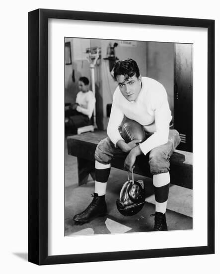 Portrait of Football Player in Locker Room-null-Framed Photo