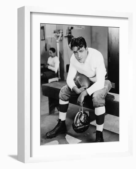 Portrait of Football Player in Locker Room-null-Framed Photo