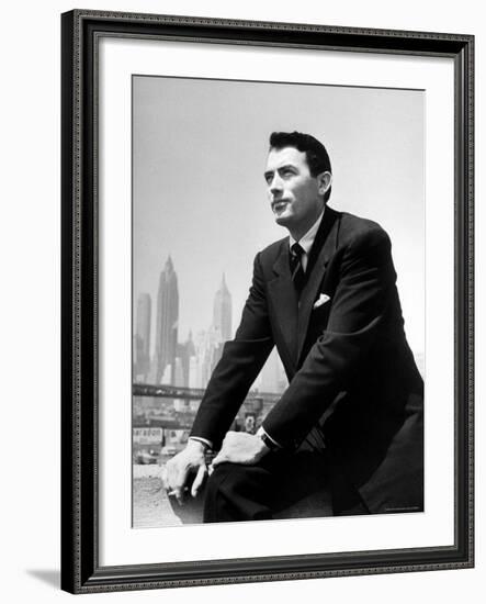 Portrait of Gregory Peck, Serious, Smoking a Cigarette-Nina Leen-Framed Premium Photographic Print