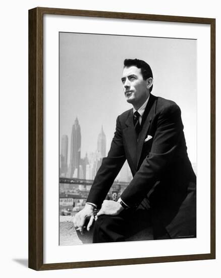 Portrait of Gregory Peck, Serious, Smoking a Cigarette-Nina Leen-Framed Premium Photographic Print