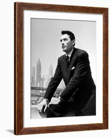 Portrait of Gregory Peck, Serious, Smoking a Cigarette-Nina Leen-Framed Premium Photographic Print