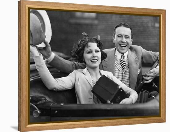 Portrait of Happy Couple Waving in Car-null-Framed Stretched Canvas