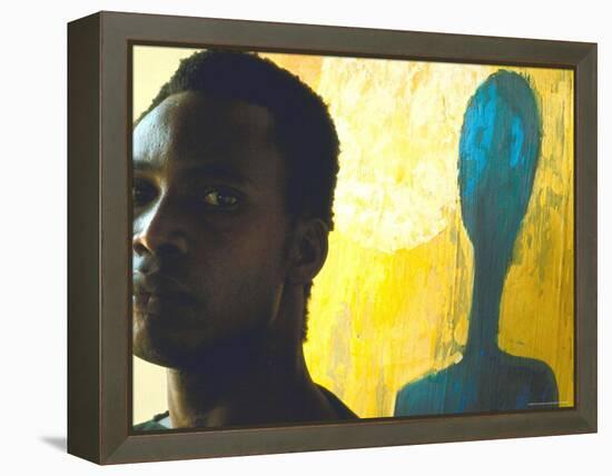 Portrait of Nigerian Artist Erhabor Emokpae Standing Next to One of His Colorful Paintings-Carlo Bavagnoli-Framed Premier Image Canvas