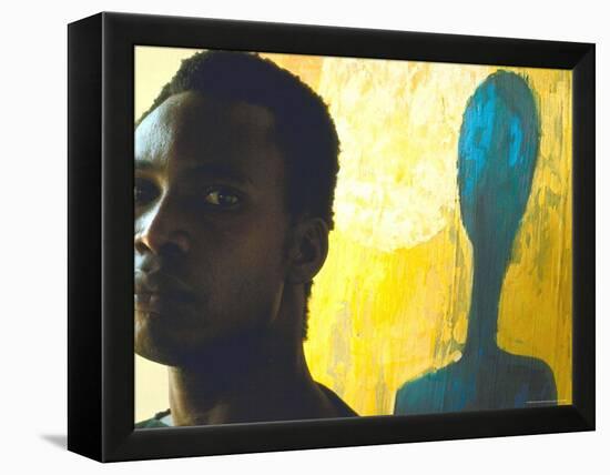 Portrait of Nigerian Artist Erhabor Emokpae Standing Next to One of His Colorful Paintings-Carlo Bavagnoli-Framed Premier Image Canvas