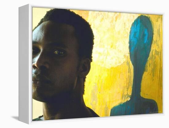 Portrait of Nigerian Artist Erhabor Emokpae Standing Next to One of His Colorful Paintings-Carlo Bavagnoli-Framed Premier Image Canvas