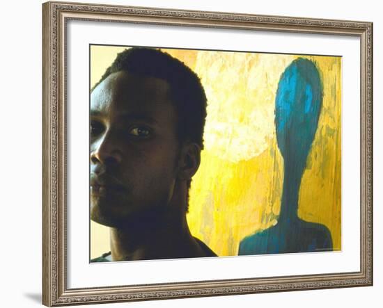 Portrait of Nigerian Artist Erhabor Emokpae Standing Next to One of His Colorful Paintings-Carlo Bavagnoli-Framed Premium Photographic Print