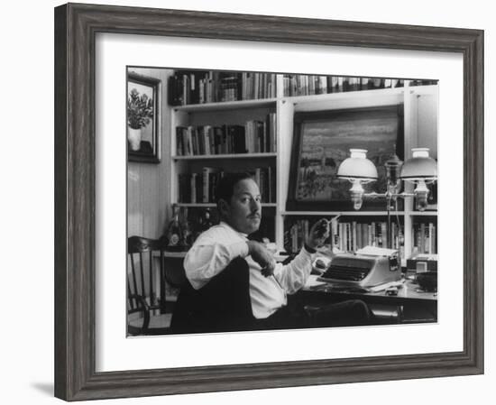 Portrait of Playwright Tennessee Williams Sitting at His Typewriter-Alfred Eisenstaedt-Framed Premium Photographic Print