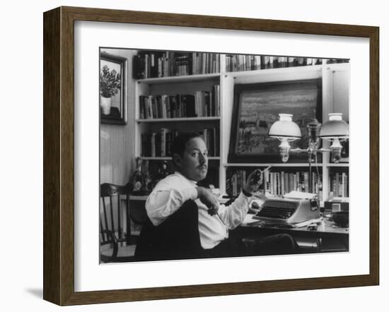 Portrait of Playwright Tennessee Williams Sitting at His Typewriter-Alfred Eisenstaedt-Framed Premium Photographic Print