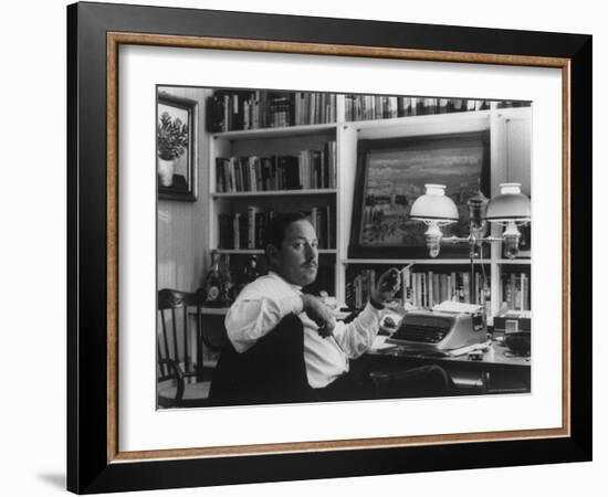 Portrait of Playwright Tennessee Williams Sitting at His Typewriter-Alfred Eisenstaedt-Framed Premium Photographic Print