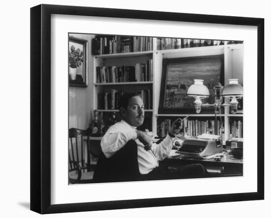 Portrait of Playwright Tennessee Williams Sitting at His Typewriter-Alfred Eisenstaedt-Framed Premium Photographic Print