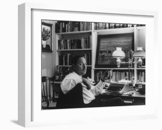 Portrait of Playwright Tennessee Williams Sitting at His Typewriter-Alfred Eisenstaedt-Framed Premium Photographic Print