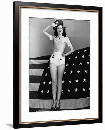 Portrait of Woman Saluting with American Flag-null-Framed Photo