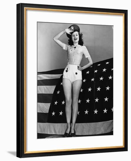 Portrait of Woman Saluting with American Flag-null-Framed Photo