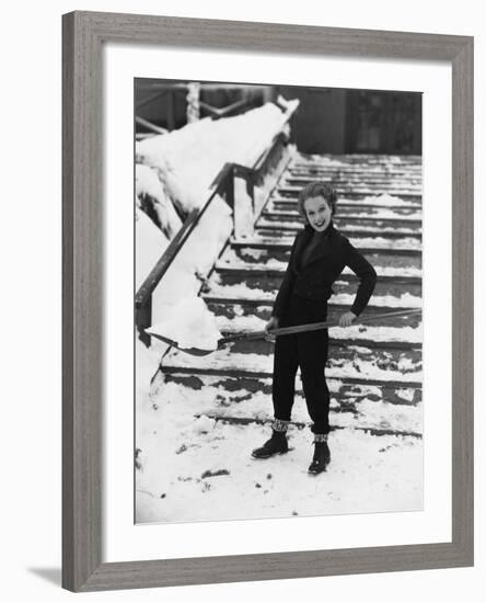 Portrait of Woman Shoveling Snow-null-Framed Photo