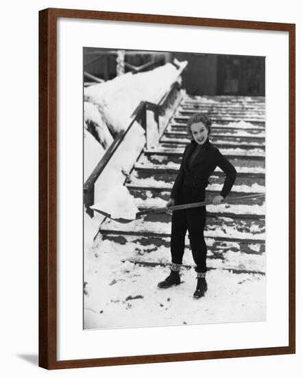 Portrait of Woman Shoveling Snow-null-Framed Photo