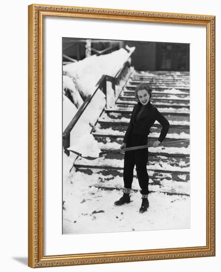 Portrait of Woman Shoveling Snow-null-Framed Photo