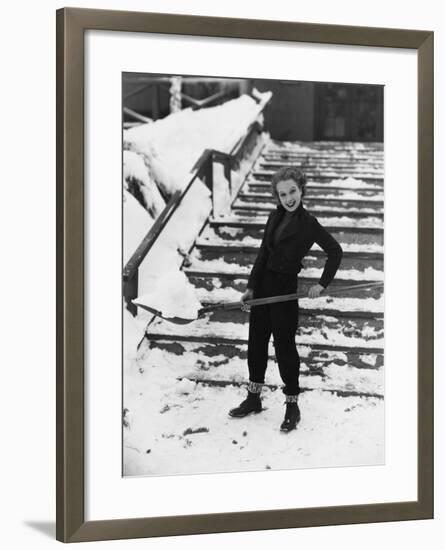 Portrait of Woman Shoveling Snow-null-Framed Photo