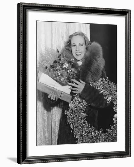 Portrait of Woman with Christmas Wreath and Gifts-null-Framed Photo