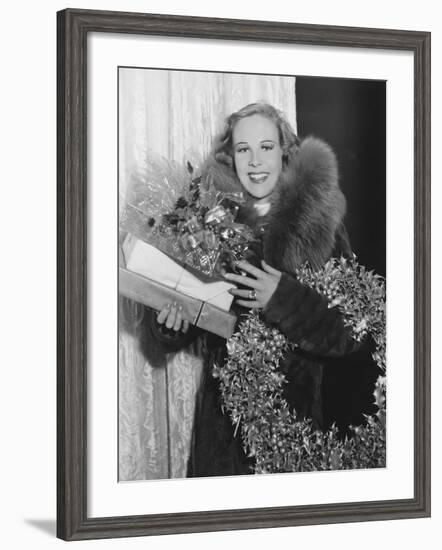 Portrait of Woman with Christmas Wreath and Gifts-null-Framed Photo