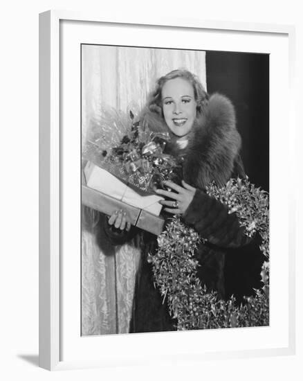 Portrait of Woman with Christmas Wreath and Gifts-null-Framed Photo