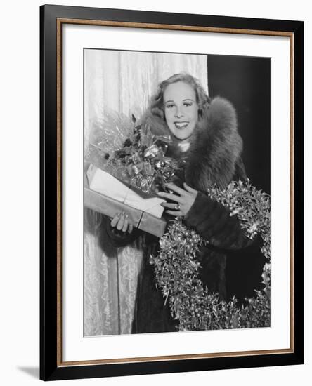 Portrait of Woman with Christmas Wreath and Gifts-null-Framed Photo