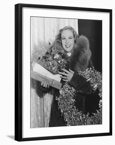 Portrait of Woman with Christmas Wreath and Gifts-null-Framed Photo