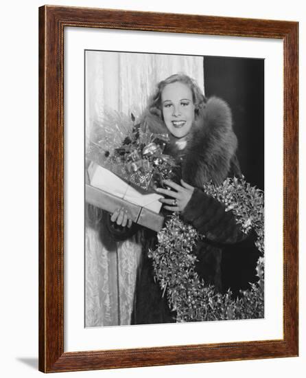 Portrait of Woman with Christmas Wreath and Gifts-null-Framed Photo