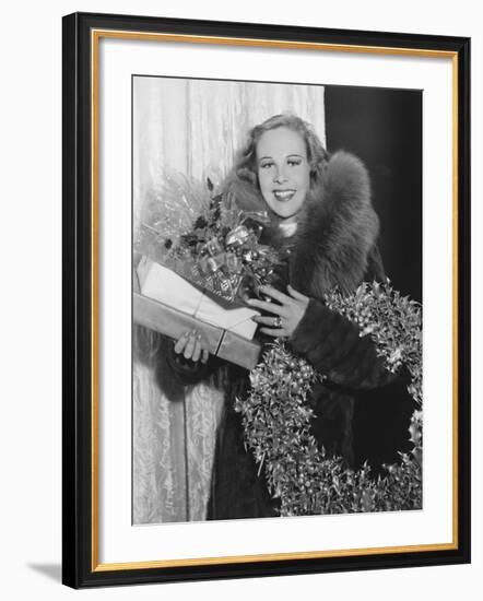 Portrait of Woman with Christmas Wreath and Gifts-null-Framed Photo