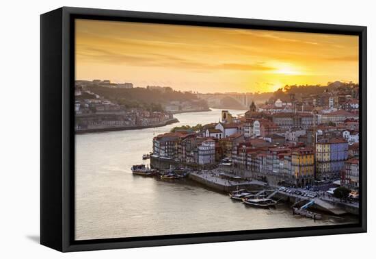 Portugal, Douro Litoral, Porto. Sunset over the UNESCO listed Ribeira district, viewed from Dom Lui-Nick Ledger-Framed Premier Image Canvas