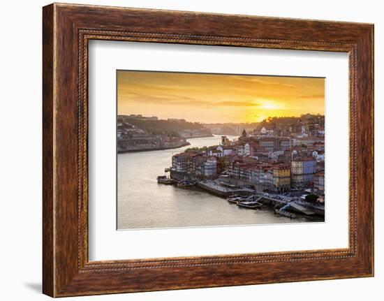 Portugal, Douro Litoral, Porto. Sunset over the UNESCO listed Ribeira district, viewed from Dom Lui-Nick Ledger-Framed Photographic Print