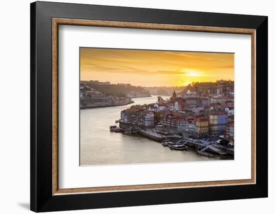 Portugal, Douro Litoral, Porto. Sunset over the UNESCO listed Ribeira district, viewed from Dom Lui-Nick Ledger-Framed Photographic Print