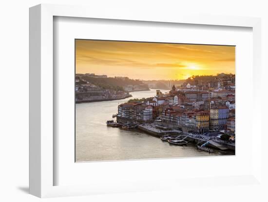 Portugal, Douro Litoral, Porto. Sunset over the UNESCO listed Ribeira district, viewed from Dom Lui-Nick Ledger-Framed Photographic Print