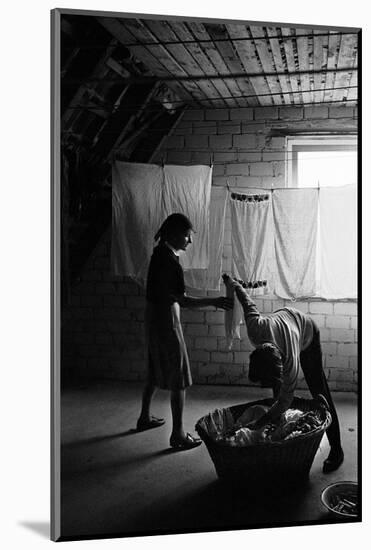 Postwar Berlin-West: hanging the washing in an attic. Berlin,1960.-Erich Lessing-Mounted Photographic Print