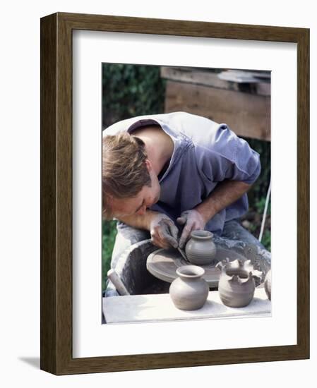 Potter at Work on Wheel at Rustic Fayre, Devon, England, United Kingdom-Ian Griffiths-Framed Photographic Print