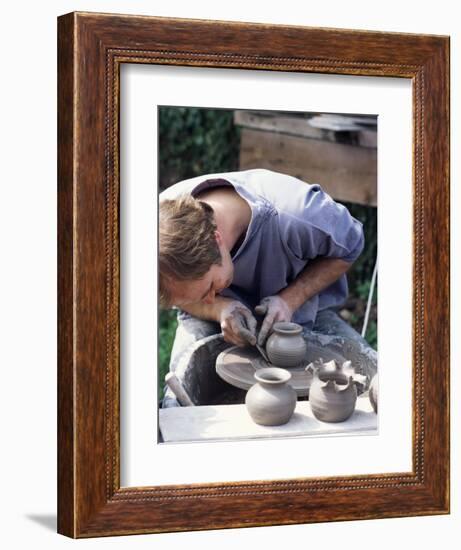 Potter at Work on Wheel at Rustic Fayre, Devon, England, United Kingdom-Ian Griffiths-Framed Photographic Print