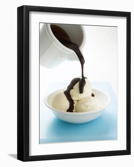 Pouring Chocolate Sauce over Vanilla Ice Cream-null-Framed Photographic Print