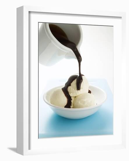 Pouring Chocolate Sauce over Vanilla Ice Cream-null-Framed Photographic Print