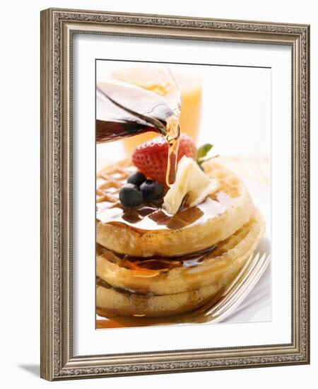 Pouring Maple Syrup over Waffles with Butter and Berries-null-Framed Photographic Print