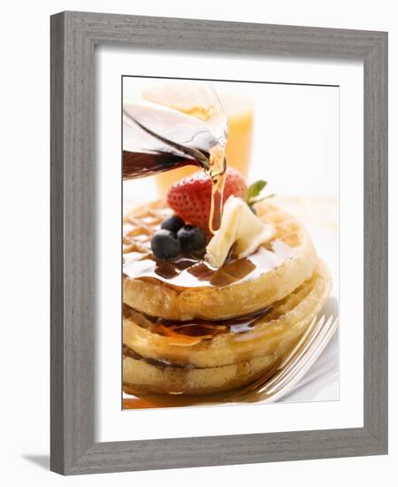 Pouring Maple Syrup over Waffles with Butter and Berries-null-Framed Photographic Print