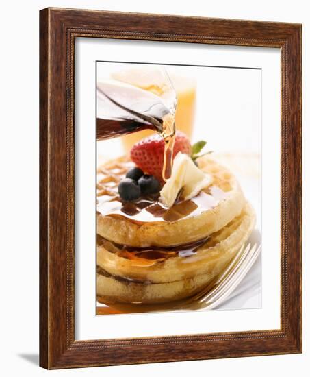 Pouring Maple Syrup over Waffles with Butter and Berries-null-Framed Photographic Print