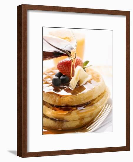 Pouring Maple Syrup over Waffles with Butter and Berries-null-Framed Photographic Print