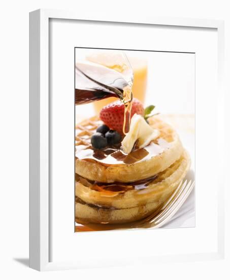 Pouring Maple Syrup over Waffles with Butter and Berries-null-Framed Photographic Print