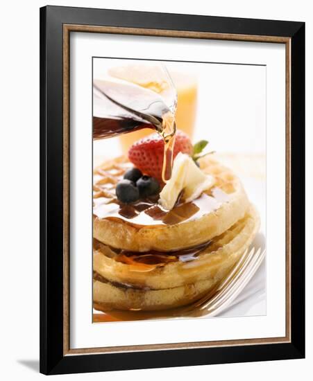 Pouring Maple Syrup over Waffles with Butter and Berries-null-Framed Photographic Print