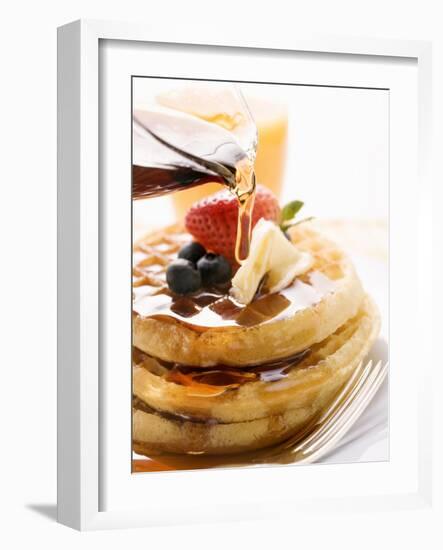 Pouring Maple Syrup over Waffles with Butter and Berries-null-Framed Photographic Print